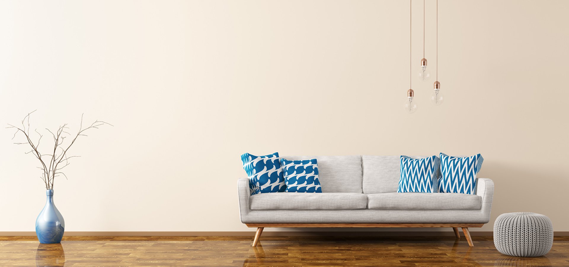 Modern interior of living room with white sofa, knitted pouf, vase and bulbs